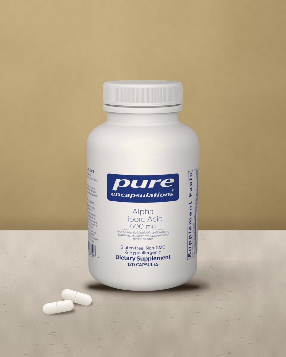 Pure Encapsulations Alpha Lipoic Acid 600 mg bottle, 120 capsules, on a pale stone ledge against a warm ochre wall with white capsules beside it