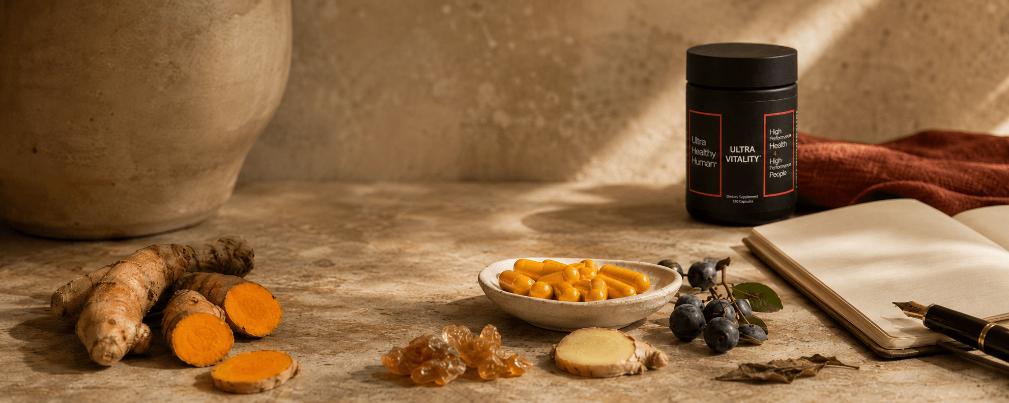 Ultra Vitality dawn ritual on a modern kitchen counter, with fresh turmeric root, capsules, a small open notebook, and a glass of water with a lemon slice
