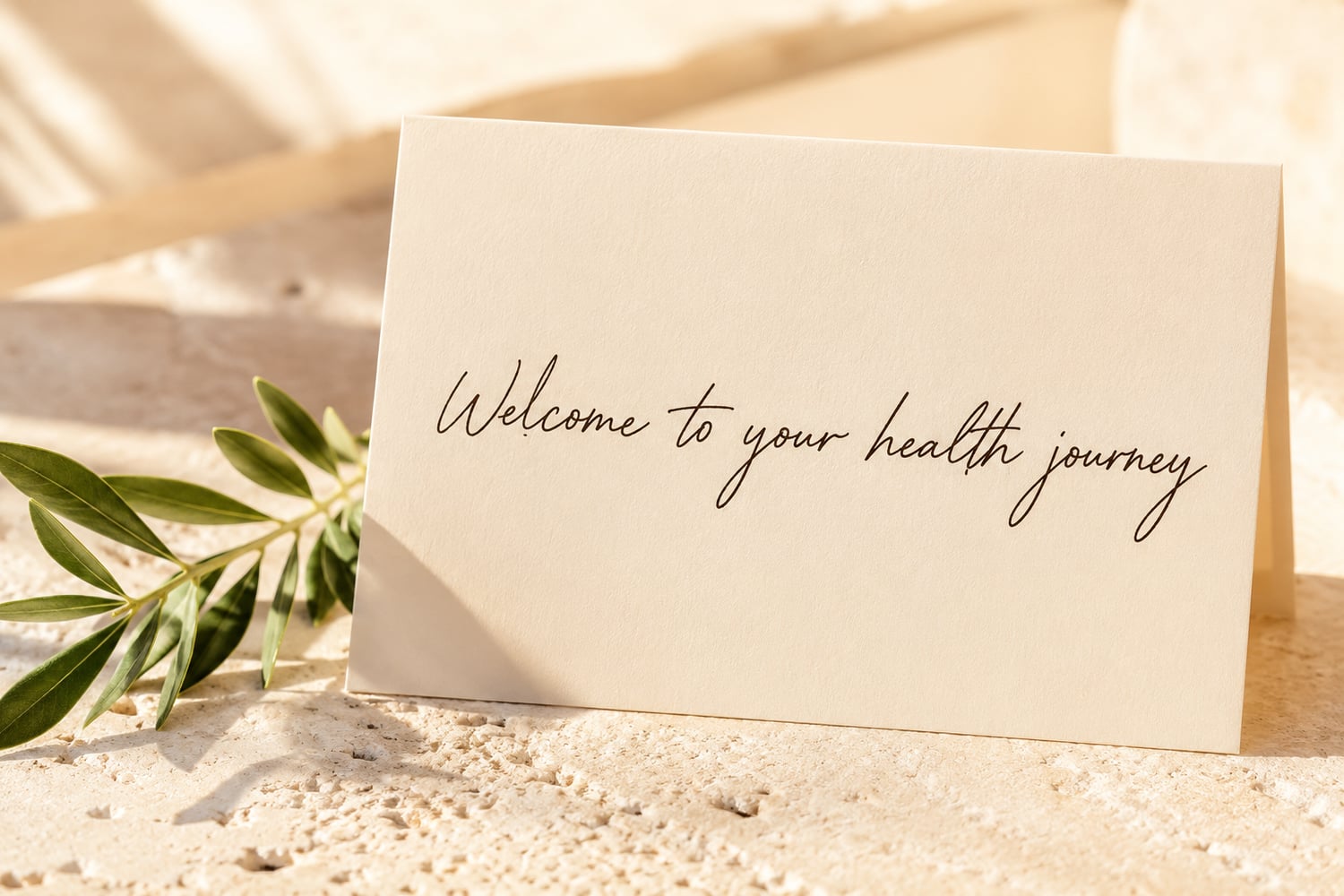 A handwritten welcome note resting in warm golden light